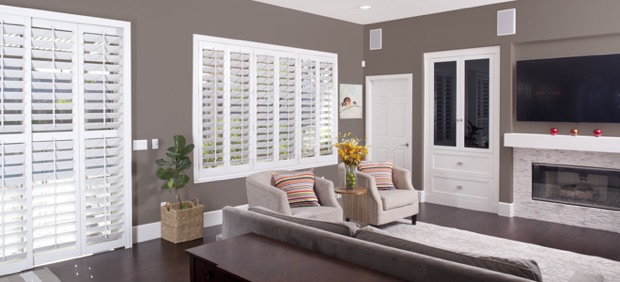 Plantation shutters with wide louvers